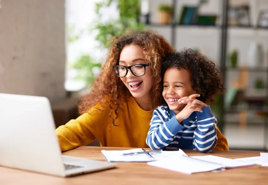 Girl Helping Toddler with Homework