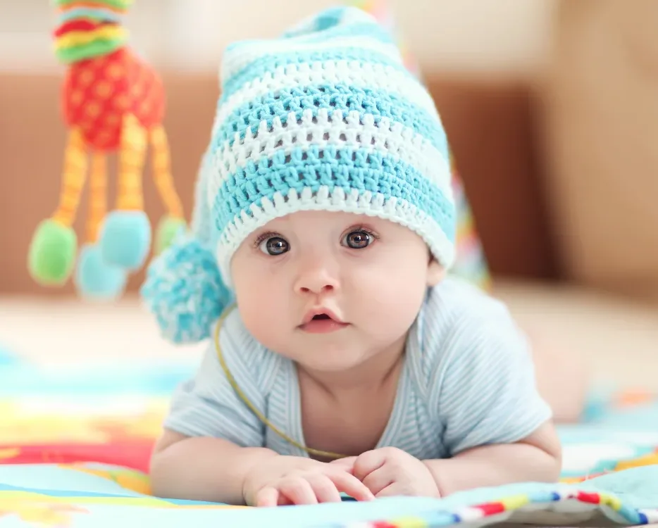 Infant laying on blanket